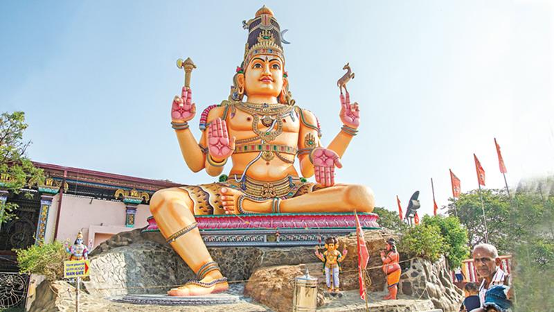 The front view of the magnificent Koneshwaran Temple with a gigantic statue of Lord Shiva 