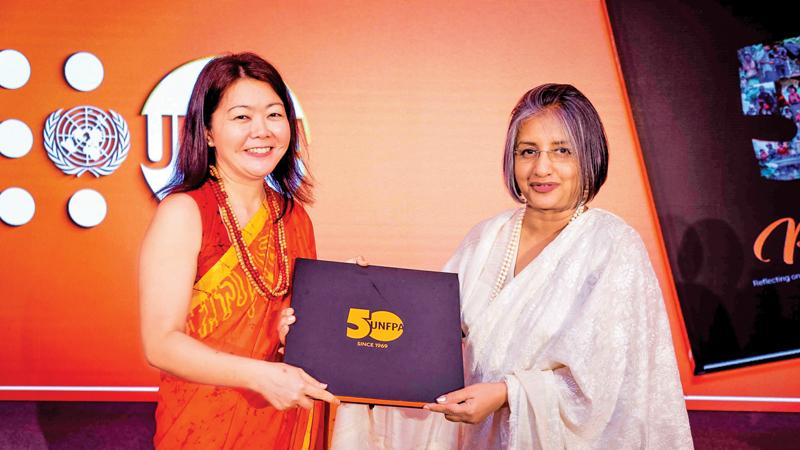 UNFPA Representative in Sri Lanka, Ritsu Nacken presenting the first copy of Perspectives to Prof. Maithree Wickremesinghe
