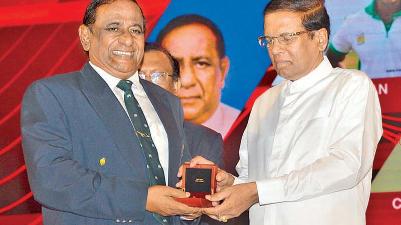 Nimal Lewke receiving the Kreeda Bhushana award from President Maithripala Sirisena for his yeomen services to rugby. Lewke was also a front-line boxer during his heydays besides being a crack commando who served as Deputy Inspector General in the Special Task Force (STF)  