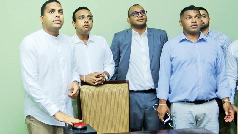 Sports Minister Harin Fernando launching the Sugathadasa Stadium Complex web site at a ceremony held on Friday in the presence of Manusha Nanayakkara MP and manager of the Sugathadasa Stadium Complex Sampath Perera  