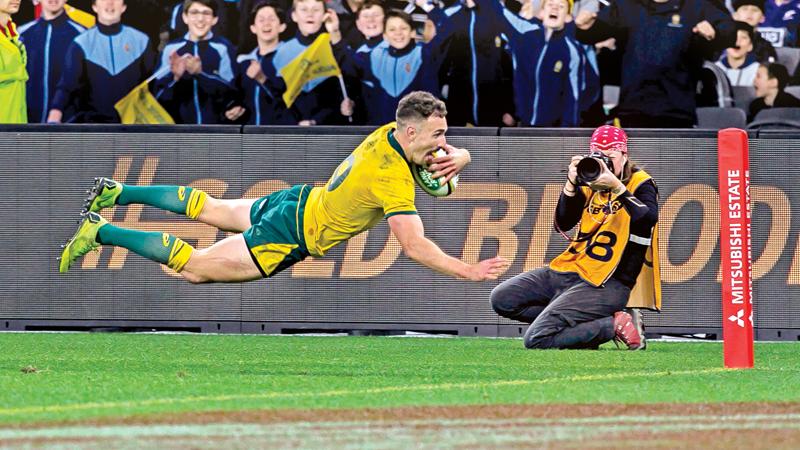 Australia’s Nic White scores a try during the Rugby Championship Bledisloe Cup Test match against New Zealand All Blacks in Perth (AFP)