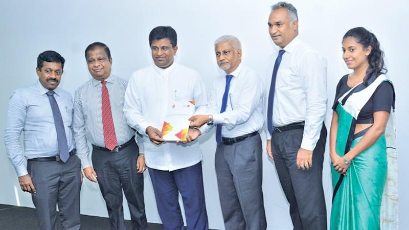 ICTA Chairman Prof. Rohan Samarajiva presents the IT-BPM Workforce Survey 2019 Report to Digital Infrastructure and Information Technology Non-Cabinet Minister Ajith P. Perera.   