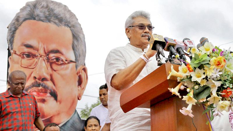 SLPP Presidential candidate Gotabaya Rajapaksa with a menacing cut-out looming behind