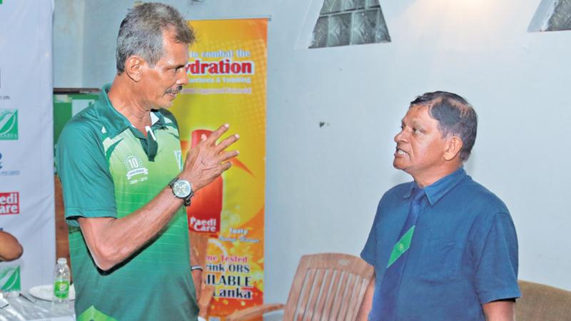 Hisham Abdeen (left) talks to his former club, Sri Lanka fullback and HARFA head coach Marco de Silva at the tournament’s launch at Havelock Sports Club (Pic by Shan Rambukwella)  