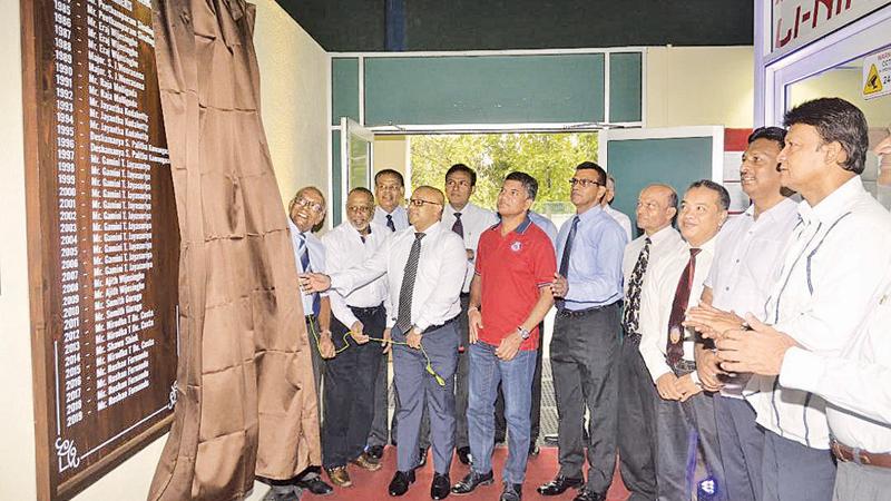 Mercantile Badminton Trust Chairman Gamini Jayasuriya and members Rohan de Silva and Roshan Fernando unveiling the plaque at the Mercantile Badminton Stadium. Also in the picture are Past Mercantile Presidents Eraj Wijesinghe, Ajith Wijayasinghe, Sumith Guruge, Nirodha de Costa, Shaun Shiek and CR and FC President Sriyan Cooray Pic: Vipula Amarasinghe