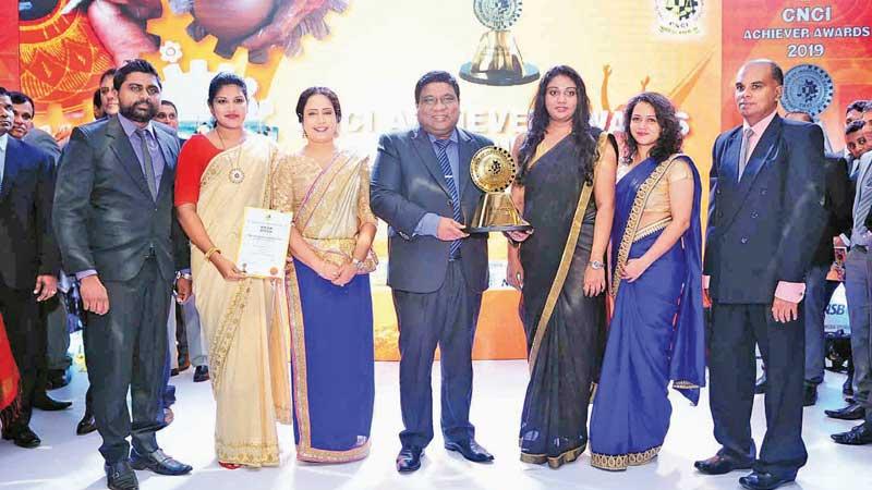 The PBSS team with the award at the CNCI annual awards ceremony.