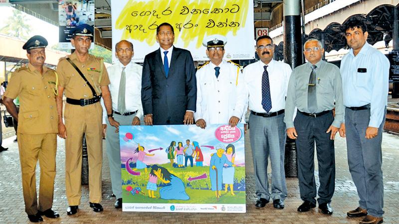 World Vision Sri Lanka and SL Railways officials with poster