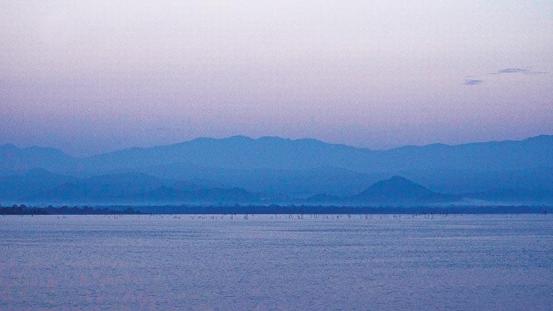 ALMOST GEMLIKE: A gleaming view of the Uda Walawe reservoir at dawn as seen from the dam  