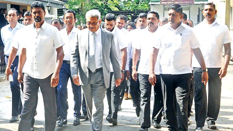 Gotabaya Rajapaksa walks out of the Special High Court in Hulftsdorp surrounded by bodyguards.  Pic courtesy: RepublicNext