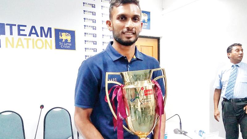 Country boy Dasun Shanaka the captain poses for the media with the prized trophy 
