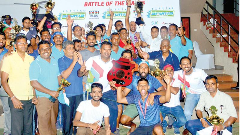 The winning Insurance Corporation teams with their Trophies presented by Chief guest former  Sri Lanka cricketer Graeme Labrooy along with Krishantha Cooray the chairman of ANCL Lake House who were the sponsors  