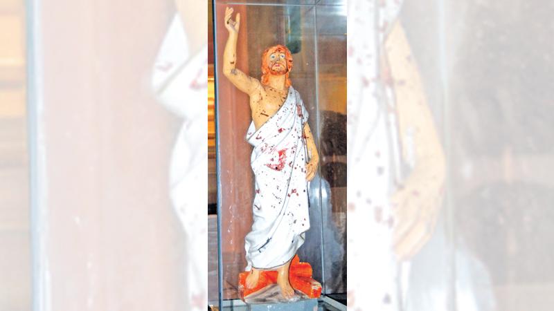 The blood spattered statue