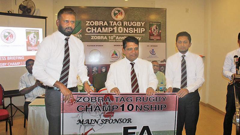 Nazeem Ghaffoor presents the main sponsorship on ehalf of Fawzan Anver to the principal of Zahira College Trizviiy Marikkar as president of the ZOBRA Hussain Wasique is looks on  