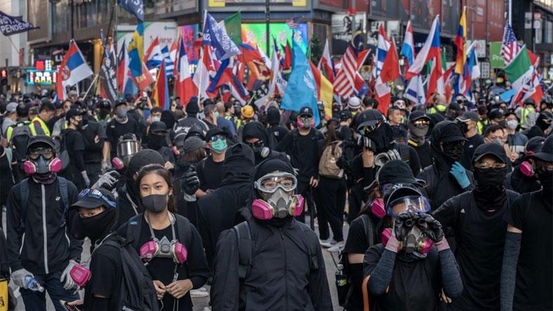 Protestors wearing masks.
