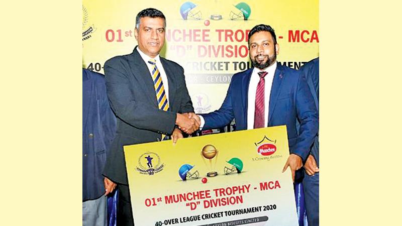 General Manager Marketing Ceylon Biscuits Limited, Janmesh Paul Anthony presents the sponsorship cheque to the president of the MCA Rohana Dissanayake  