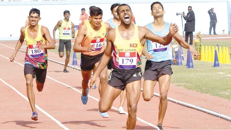 Sri Lanka’s Indunil Herath wins the Gold medal in the 800 metres at the South Asian Games in Katmandu, Nepal yesterday (AFP)