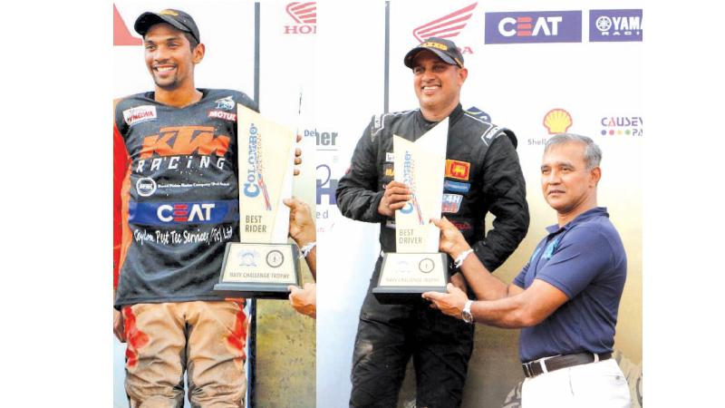 Champion rider at the Colombo Supercross 2019 at the Welisara naval track Jacques Gunawardena (left) and winning driver Ashan Silva receive their coveted trophies from Chief of Staff of the Navy Nishantha Udagedera (Pix by Saman Sri Wedage)    