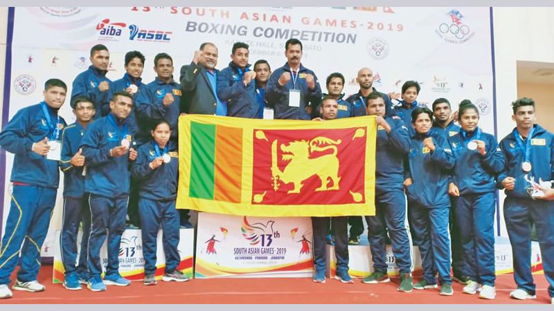The Sri Lanka boxing squad that competed at the recently concluded 13th South Asian Games in Nepal comprising Sanjeewa Nuean 49 kgs, KVL Eranda  52 kg (Bronze), GNK Amarawansa 56Kgs, Wimukthi Kumara 60 kgs (Bronze), PVDD Saparamadu 64 kgs (Bronze), NM Hettiarachchi 69kgs, PDD Maduranga 75 kgs (Silver), WAR Sandakalum 81 kgs (Gold), ARBE Tillekaratne 91 kgs (Bronze), Nadeeka Pushpakumari 49 kgs (Bronze), KAK Nilmini 51 kgs (Bronze), MPPS Cooray 54 kgs (Bronze), KAD Dharmathilaka  57 kgs (Silver), KAK Hansika