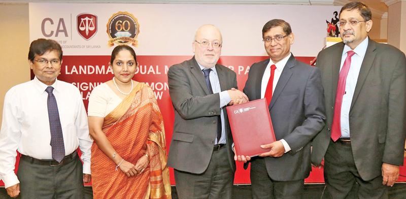 President of CA Sri Lanka Jagath Perera, exchanges the MoU with Executive Director, Learning and Professional Development, ICAEW Mark Protherough. The Institute’s Vice President Manil Jayesinghe, CEO Dulani Fernando and Secretary Prasanna Liyanage look on.   