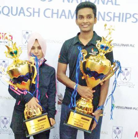 Ravindu Laksiri (right) and Fathoum Issadeen pose with their titles 