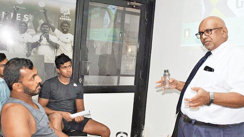 Sri Lanka rugby players Sajith Saranga (CH and FC) and Riza Riffaideen (CR and FC) listen to a lecture given by Dr. Seevali Jayawickrema, the head of anti doping