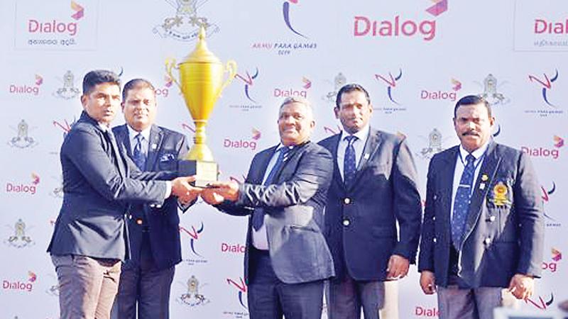 Major Anura Tennakoon of the Sri Lanka Light Infantry Regiment receiving the award for the overall champion at the Army Para Games 2019 from KDS Ruwan Chandra the Secretary of the Ministry of Sports in the presence of Army commander Lt Gen Shavendra Silva