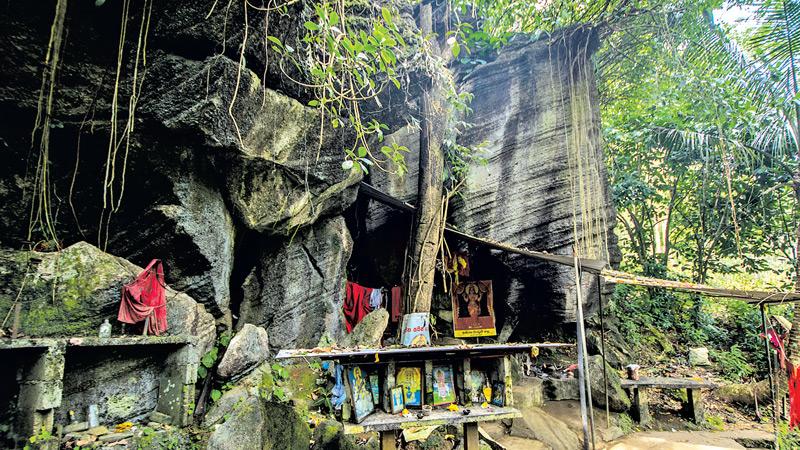 QUAINT CHARM: The Purana Pattini Devale at Koththalena inside the growing rock boulder