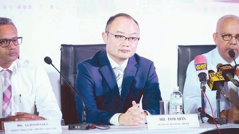 Micro Cars Limited Chairman Dr. Lawrence Perera with officials of Higer Bus Company Korea at a media briefing in Colombo.