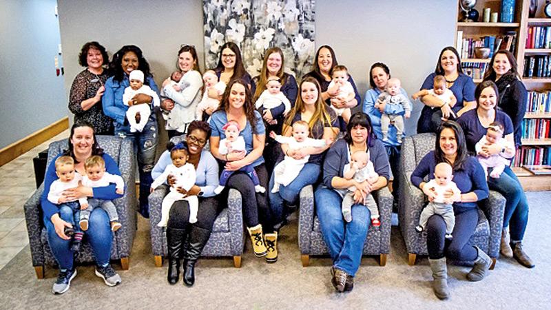 Some of the moms who gave birth in 2019 are photographed with their children.