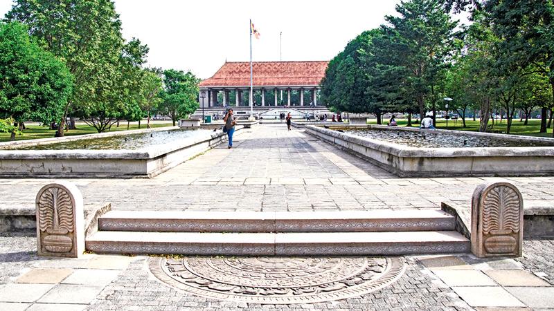 The memorial hall in the distance. The stone pathway flanked by narrow ponds and the sculptured moonstone  