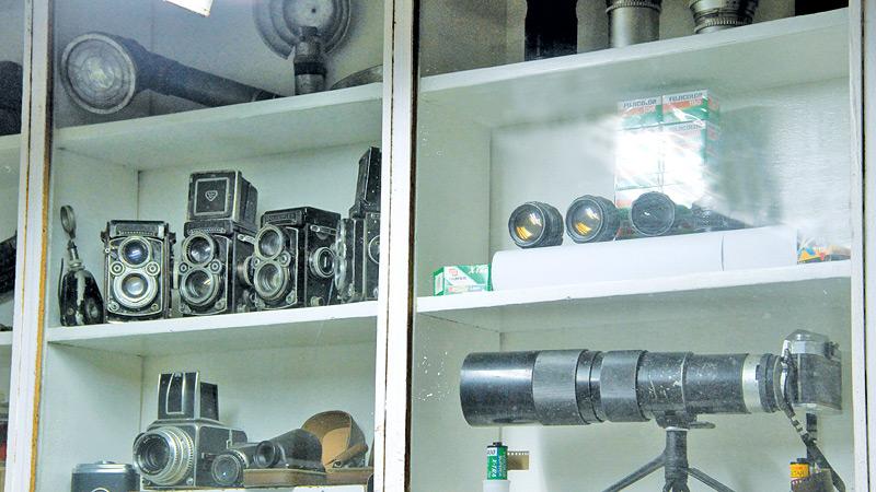PHOTOGRAPHIC REPOSITORY: Medium format Rolleiflex and Hasselblad film cameras on display at the Editorial Photo Department of Lake House  