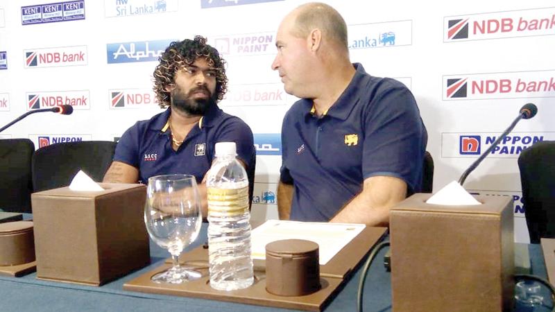 Lasith Malinga talks to coach Mickey Arthur at the lauch of Sri Lanka versus West Indies series