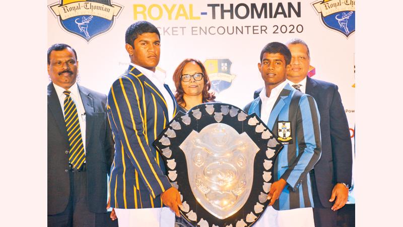 The captains of Royal College, Thevindu Senaratne-left and S. Thomas’ College, Thevin Eriyagama pose with the DS Senanayake Shield at the launch of the 141st Battle of the Blues big match at the BMICH on Wednesday in the presence of Royal College Principal B.A. Abeyratne (left), Amali Nanayakkara, Group Chief Marketing Officer, Dialog and Navin Peiris, VP Enterprise Business and Large Enterprise Sales, Dialog  (Pic: Ranjith Asanka)