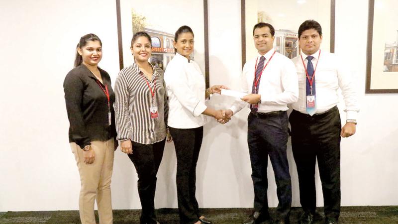 Singer Marketing team led by Marketing Director, Singer Sri Lanka, Shanil Perera holds the partnership agreement with Dushanthi Madanayake.  