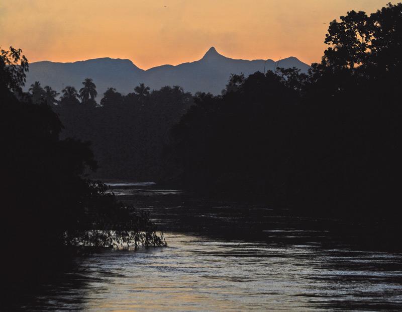 5.50 am: The river forms a stunning background scenery with the Sri Pada mountain range at Embulgama, Hanwella in the background   