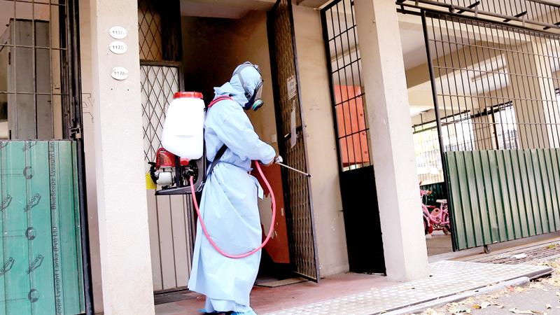 A house of a COVID-19 positive patient being disinfected A house of a COVID-19 positive patient being disinfected Pic- Rukmal Gamage