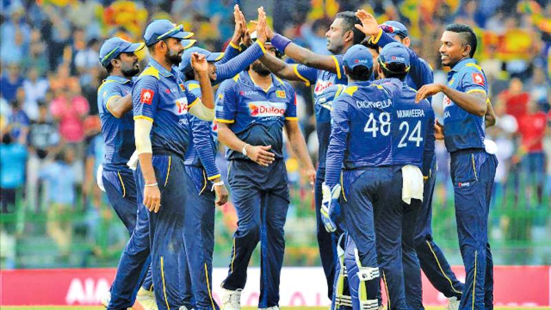 Sri Lankan cricketers celebrate an on-field moment in this file photo
