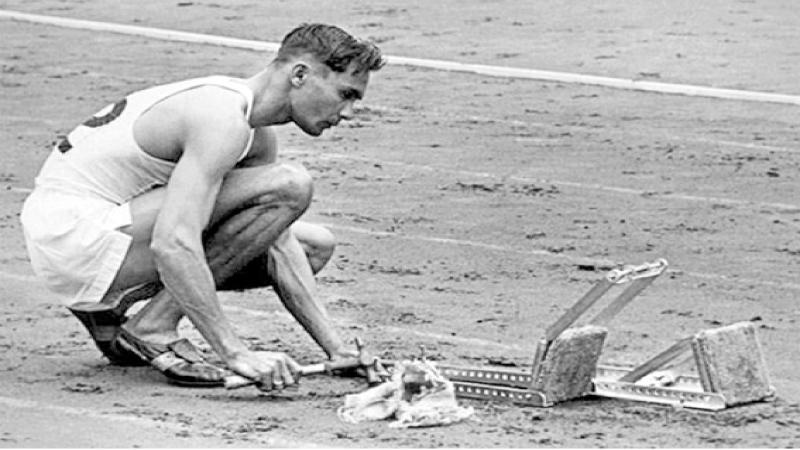 An iconic moment: A determined Duncan White fixing his starting blocks at the London 1948 Olympic Games 400m Hurdles final