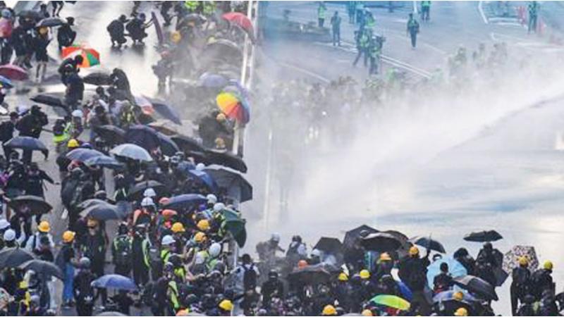 In early September, police started using a new tactic - spraying indelible blue dye over the protesters, meaning those who ran away could be identified later
