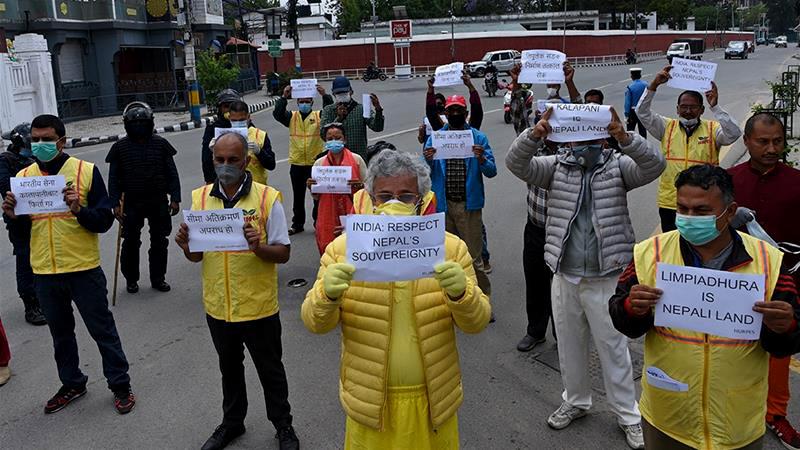 Activists protest against India's newly inaugurated link road to the Chinese border, near the Indian embassy in Kathmandu