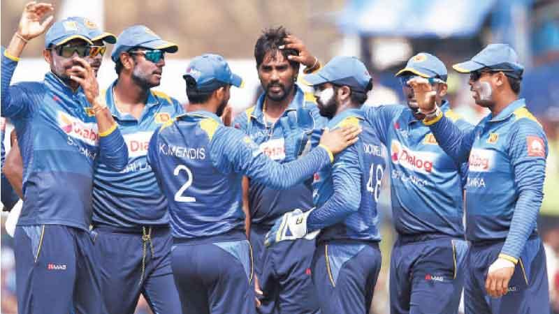 Members of the Sri Lanka team celebrate an on-field occasion