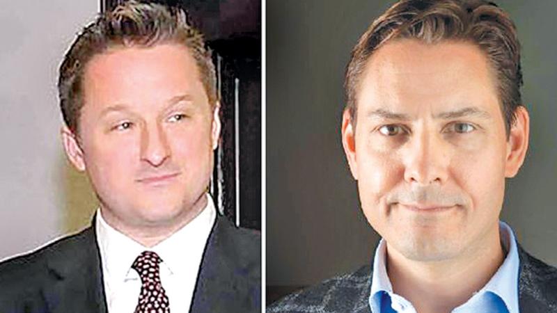 Michael Spavor (L) and Michael Kovrig have been held since December 2018 (AFP)