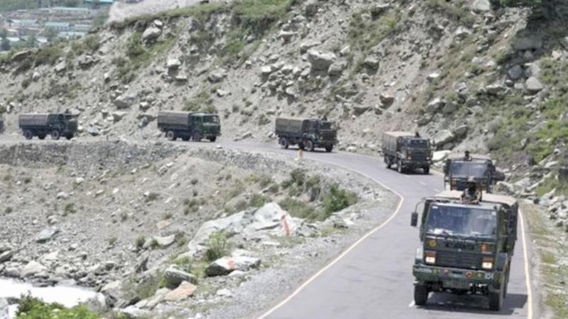 Indian Army trucks move along a highway leading to Ladakh