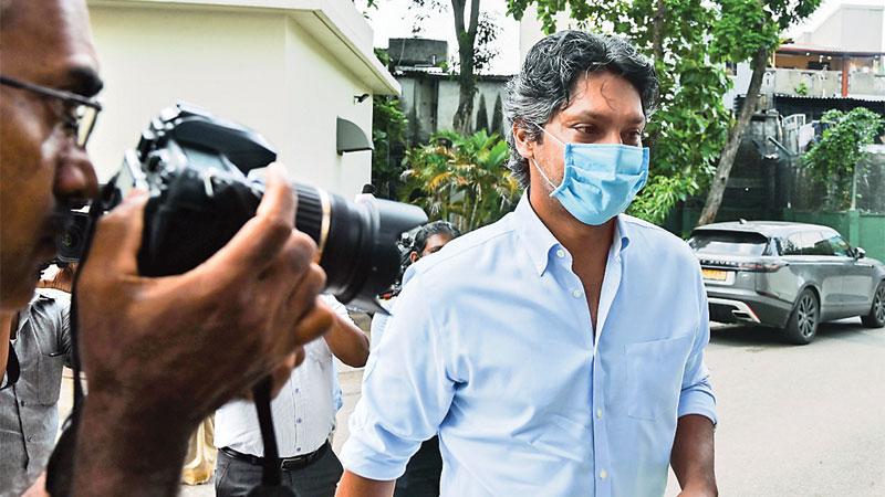 Sri Lanka's Kumar Sangakkara, the captain of the losing side at the 2011 Cricket World Cup, arrives at the Special Investigation Unit to be interviewed by police in Colombo reads the caption of this AFP photo taken by Lakruwan WANNIARACHCHI for international consumption 