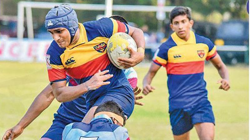 In this picture taken by ThePapare website schoolboys from Trinity College and St. Anthony’s College feature in their rugby match in the 2020 season that came to an end after just two weeks 