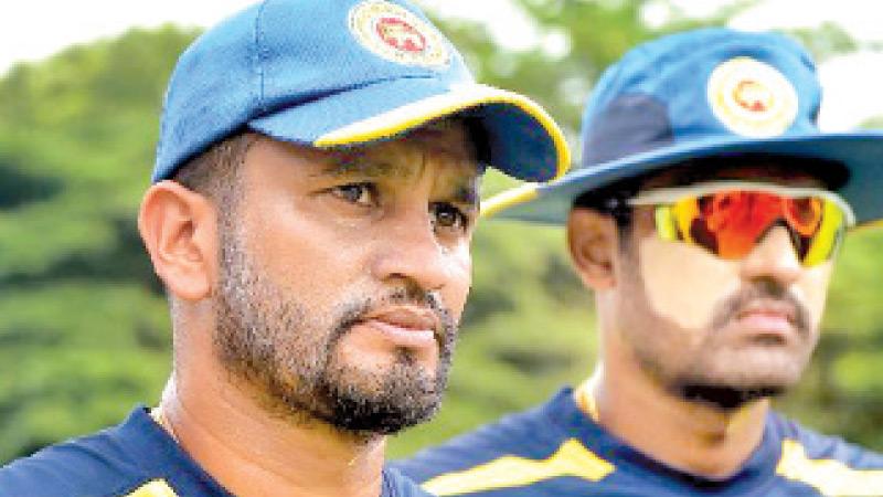 Sri Lanka Test captain Dimuth Karunaratne (left) and Thisara Perera at a recent training session in Pallekele