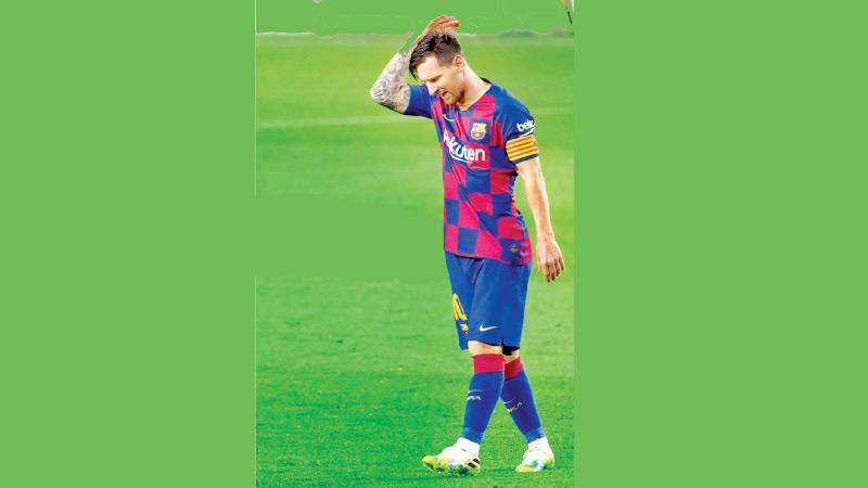 Barcelona's Argentine forward Lionel Messi gestures during the Spanish League football match between FC Barcelona and CA Osasuna at the Camp Nou stadium in Barcelona on July 16, 2020 (AFP)