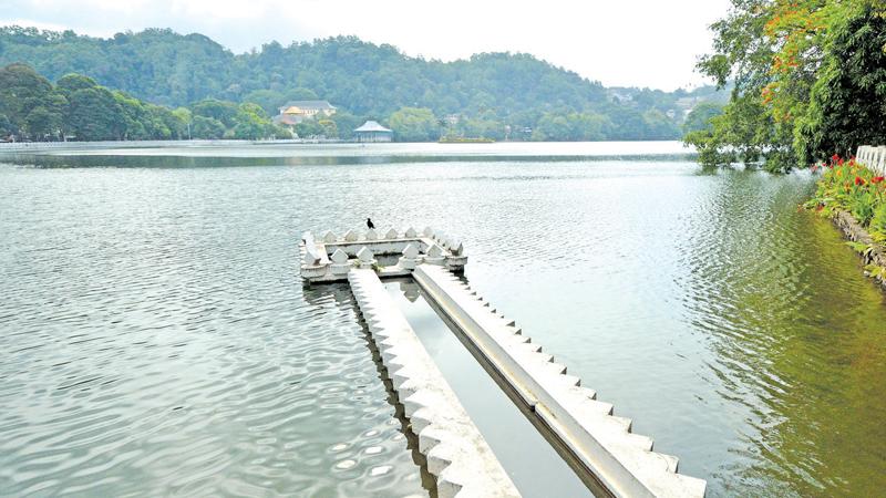 The man-made Kandy Lake and niched parapets