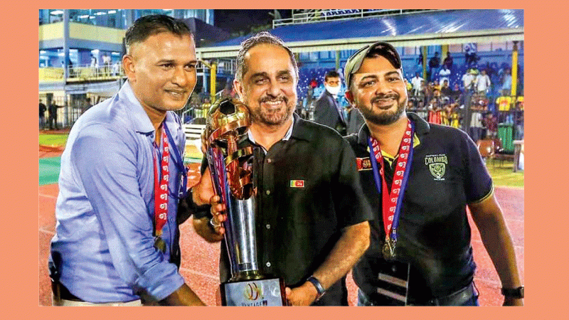 From left- MH Roomy, head coach, Colombo FC holds the Vantage FFSL President’s Cup with Hanif Yusoof, the club’s patron and Saif Yusoof, the founder, owner and president of Colombo FC    