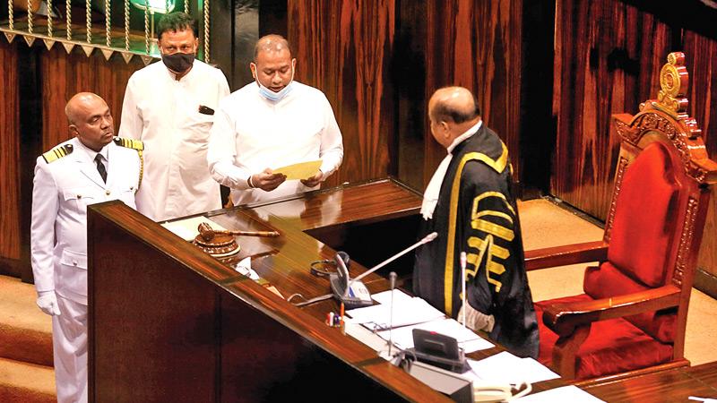 Premalal Jayasekera takes oaths as an MP before the Speaker on September 8. Pic: Sulochana Gamage